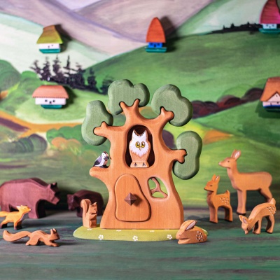 The treehouse compared in size to a familiar object like a child's hand or another small toy.