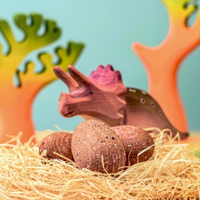 Play scene with Wooden Triceratops Eggs and dinosaur toys