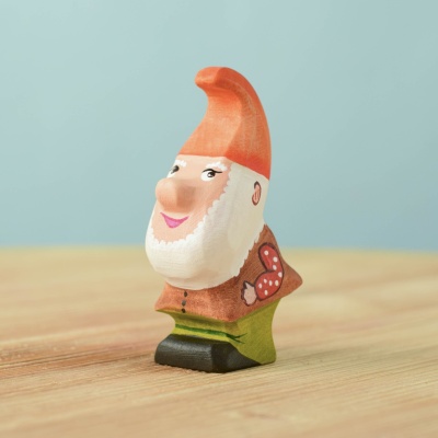 Handcrafted wooden Tumble Dwarf with a playful stance.