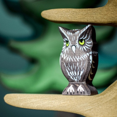 Image of the owl toy being used in a Waldorf-inspired play scene.