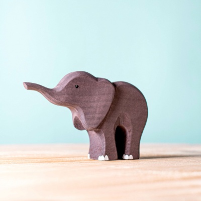 Wooden family of elephants by BumbuToys, exploring around hand-painted Savanna Rocks