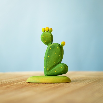 Handcrafted wooden prickly pear cactus on a wooden surface
