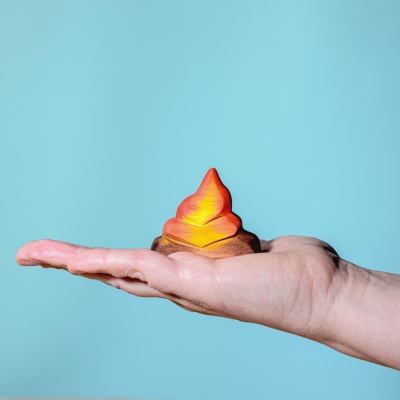 The inviting flicker of a BumbuToys wooden Campfire set enhances any imaginative play collection.