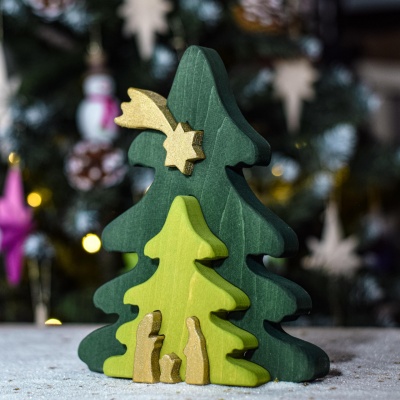 The completed puzzle displayed on a shelf, decorated with festive ornaments and lights.