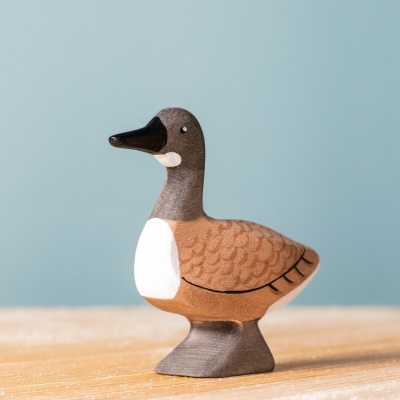 Close-up image of the Wild Goose, highlighting its hand-painted details, orange beak, and friendly expression.