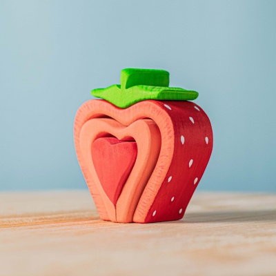 Handcrafted wooden grapes, rich in color, from BumbuToys' play food collection.