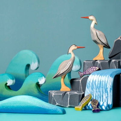 The Grey Heron toy, a BumbuToys creation, poised as if surveying the waters for a catch.