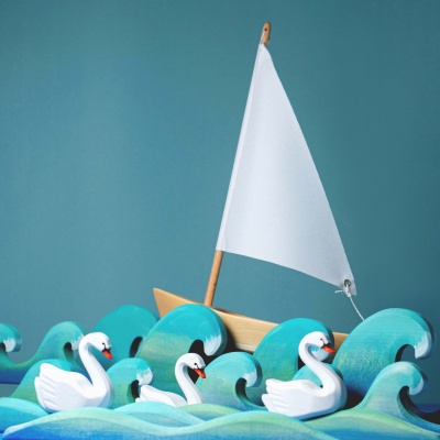 Serene swan duo on a heart-shaped water body, a craft of elegance and love.
