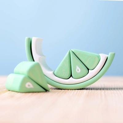 Refreshingly green puzzle pieces shaped like lime wedges by BumbuToys, perfect for imaginative play.