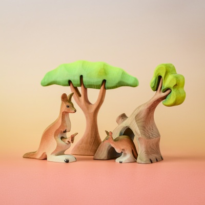 Wooden kangaroo family under trees in imaginative play scene