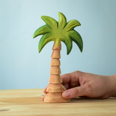 Small Palm Tree wooden toy held in hand