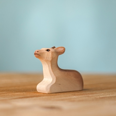 Handmade wooden Sitting Reindeer Calf figure with head raised