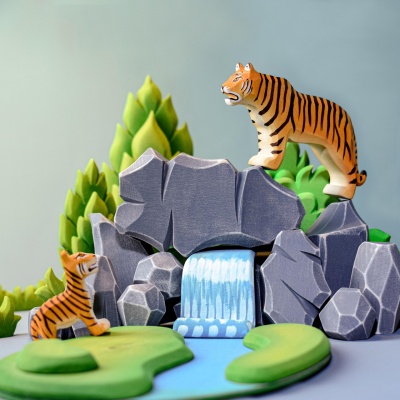 Tiger cub toy in playful stance, BumbuToys design