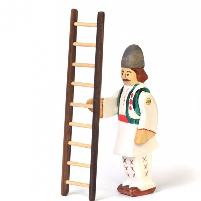 Wooden step ladder in its unfolded position against a plain wall.