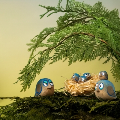 BumbuToys wooden Heartwood Tree filled with a complete collection of large medium and small bluebirds