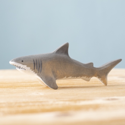 Handmade wooden shark toy on wooden surface – Bumbu Toys