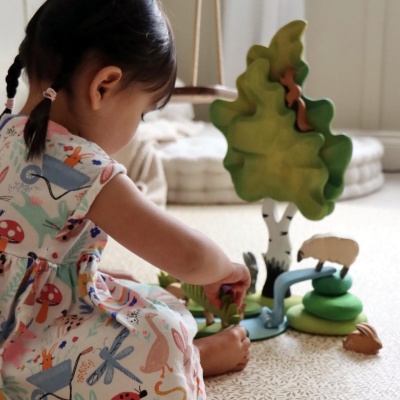 The sheep figurine featured alongside other Bumbu Toys animal figurines, showcasing a farmyard collection.