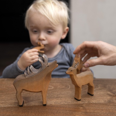 The stag toy displayed on a Montessori shelf, encouraging open-ended play.