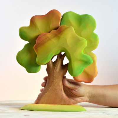 A wooden oak tree in autumnal glory, crafted by BumbuToys for educational and creative play.