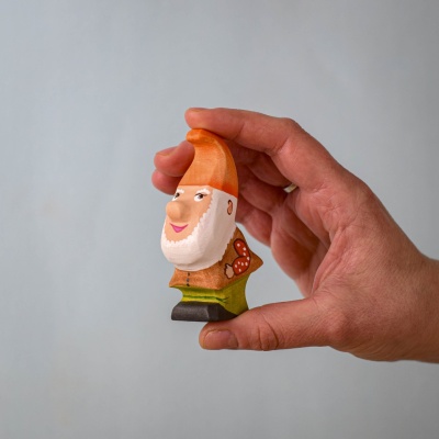 Tumble Dwarf held in hand, showcasing its detailed craftsmanship.