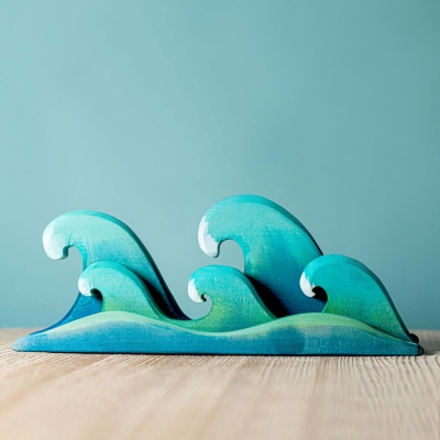 Set of three wooden waves by BumbuToys, bringing the sea's tranquility indoors.
