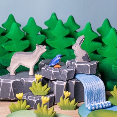 Close-up photo showcasing the smooth, sanded texture of the wooden tree figurine.