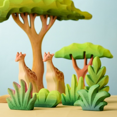 Bushes SET among other wooden toy plants and animals.