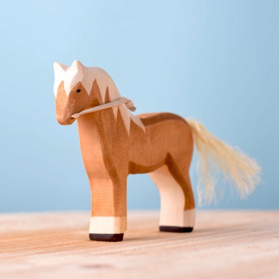 Image of a hand-carved wooden figurine of a horse