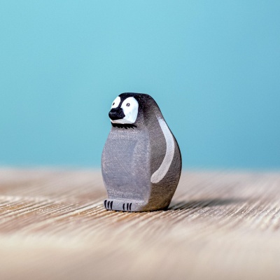 Adorable wooden Emperor Penguin Cub from BumbuToys, capturing the essence of young Antarctic wildlife.