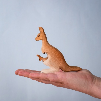 Mama kangaroo and joey toy resting in the palm of a hand