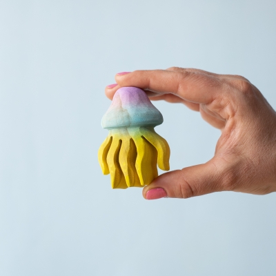 Jellyfish toy held between fingers to show size and shape