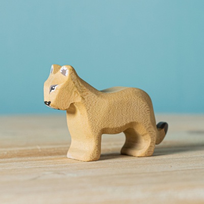 Hand-carved Lion Cub by BumbuToys, capturing the playful spirit of the jungle's future king.