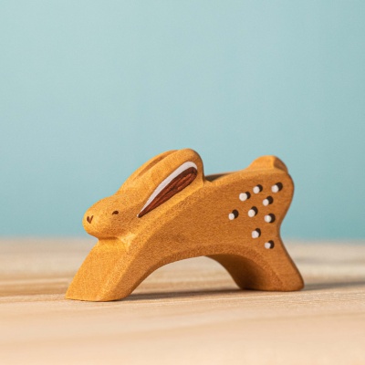 Closeup of running rabbit toy, hand-painted details