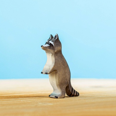 Standing wooden raccoon toy, part of a detailed raccoon family set by Bumbu Toys