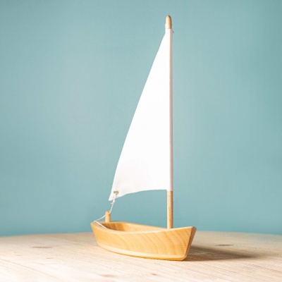 White Sailboat Toy Promoting Educational Fun