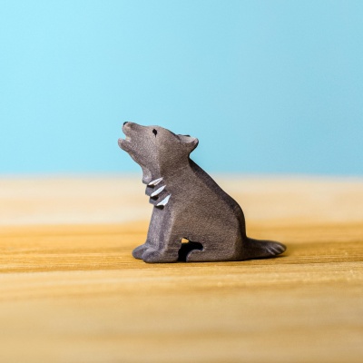 Wolf cub sitting