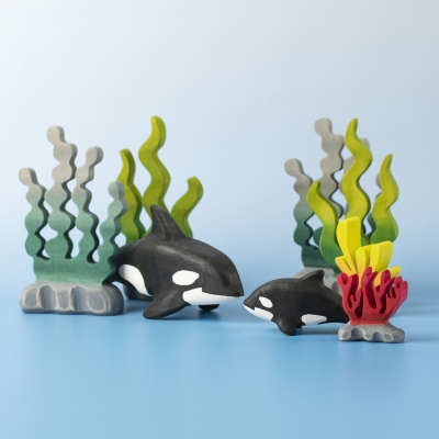 Orca Set displayed in an underwater scene with coral and seaweed