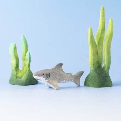 Baby Shark displayed between coral and seaweed – part of Bumbu's ocean collection