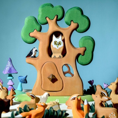 The "The Ancient Oak" incorporated into a larger nature-themed play space with animal figures, furniture, and other toys.