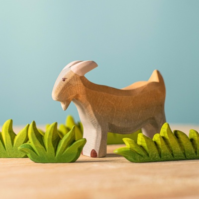 The Billy Goat incorporated into a sensory bin with hay, straw, and other farmyard-themed textures.