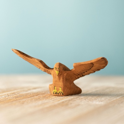 Handcrafted wooden Eagle toy by BumbuToys with wings spread in flight