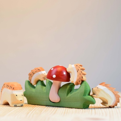 The Hedgehog Big toy incorporated into a larger nature-themed play space with trees, mushrooms, and other toys.