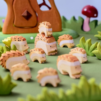 A miniature Hedgehog Small from BumbuToys, captured in mid-snuffle amongst the underbrush.