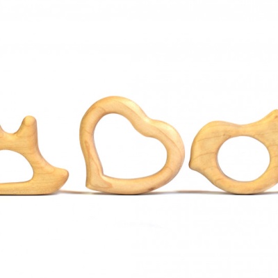 Embrace eco-friendly teething with the BABY Bear Cub wooden ring by BumbuToys.