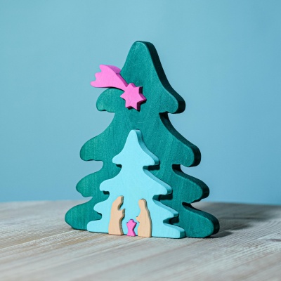 Child playing with eco-friendly Christmas Tree Puzzle in fuchsia