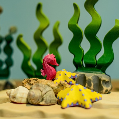 Artistic representation of the Seahorse toy in a whimsical marine scene