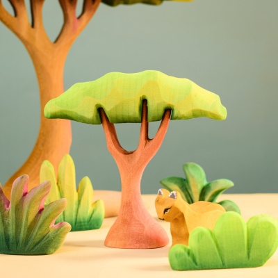 Small Acacia Tree among other wooden toy trees and animals.