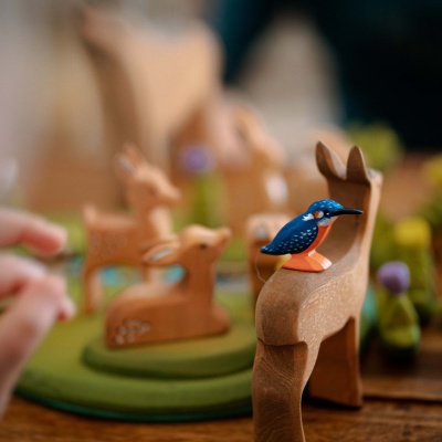 Artisanal wooden deer, bringing a touch of wilderness to playtime.