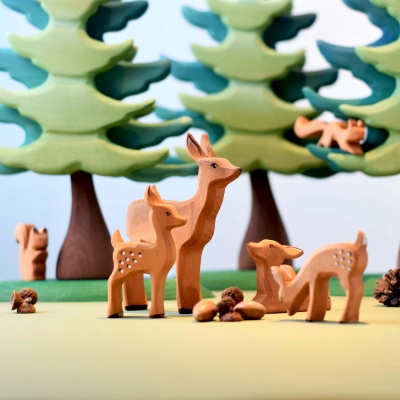 Non-toxic painted resting fawn, safe for children's playtime.