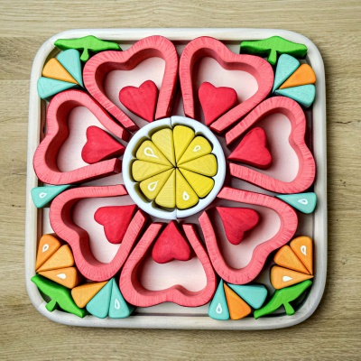 Ripe for play, BumbuToys' Strawberry toy with intricate seed detailing.